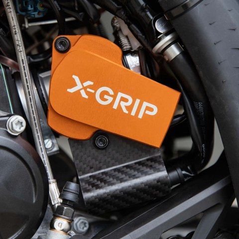 X-GRIP OSŁONA TBI (TBI-PROTECTOR) KTM SX/EXC '23-, HUSQVARNA TC/ TE '24-, GASGAS EC/MC '24-, KOLOR POMARAŃCZOWY